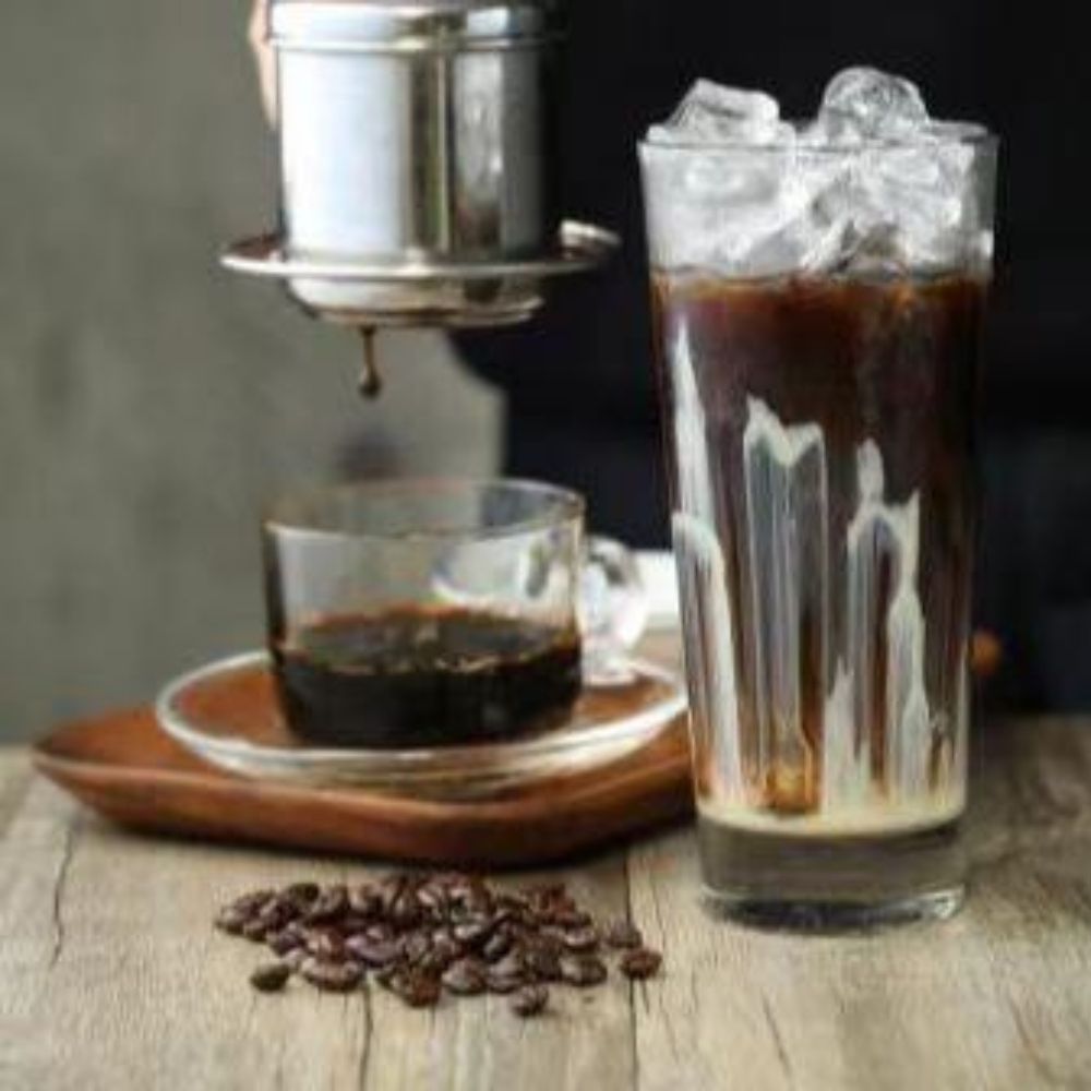Mama-Hong’s-Pho-&-Bistro-Vietnamese-Restaurant-Vietnamese-Drip-Coffee-Mustang Traditional Vietnamese drip coffee being made, ready to enjoy over ice at Mama Hong's Pho & Bistro, a Vietnamese Restaurant in Mustang.
