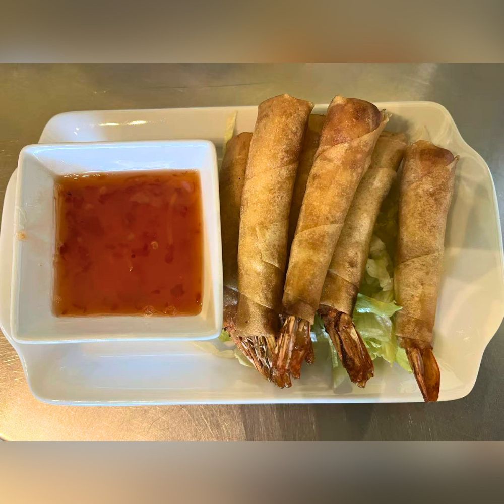Mama-Hong’s-Pho-&-Bistro-Vietnamese-Restaurant-Shrimp-Spring-Rolls-Mustang Crispy shrimp spring rolls served with a side of dipping sauce at Mama Hong's Pho & Bistro, a Vietnamese Restaurant in Mustang.