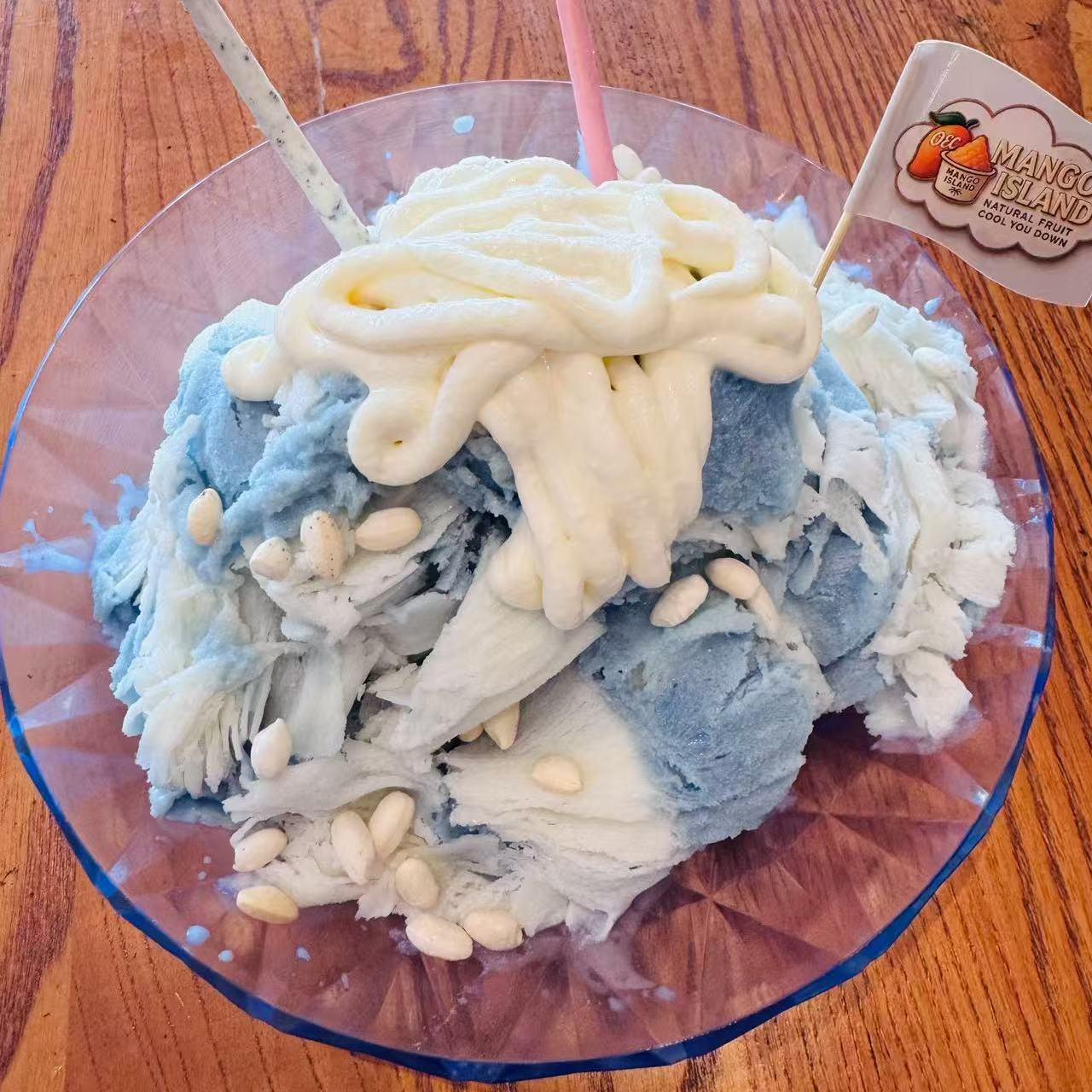 Blue and white shaved ice topped with cream and nuts at Mango Island, a Chinese Taiwanese Restaurant in Orlando