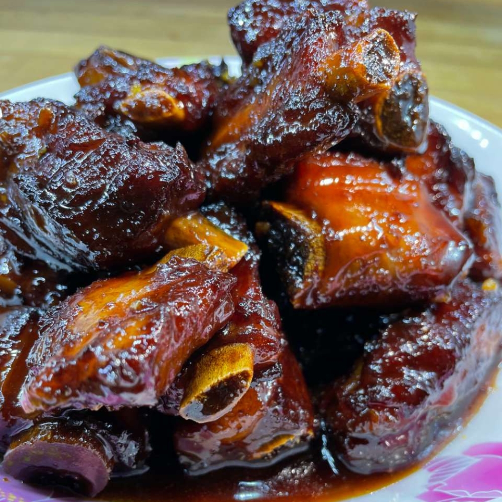Maple-Garden-Chinese-Restaurant-Sweet-and-Sour-Spare-Ribs-Whitby Tender spare ribs coated in a glossy sweet - and - sour sauce at Maple Garden, a Chinese restaurant in Whitby.