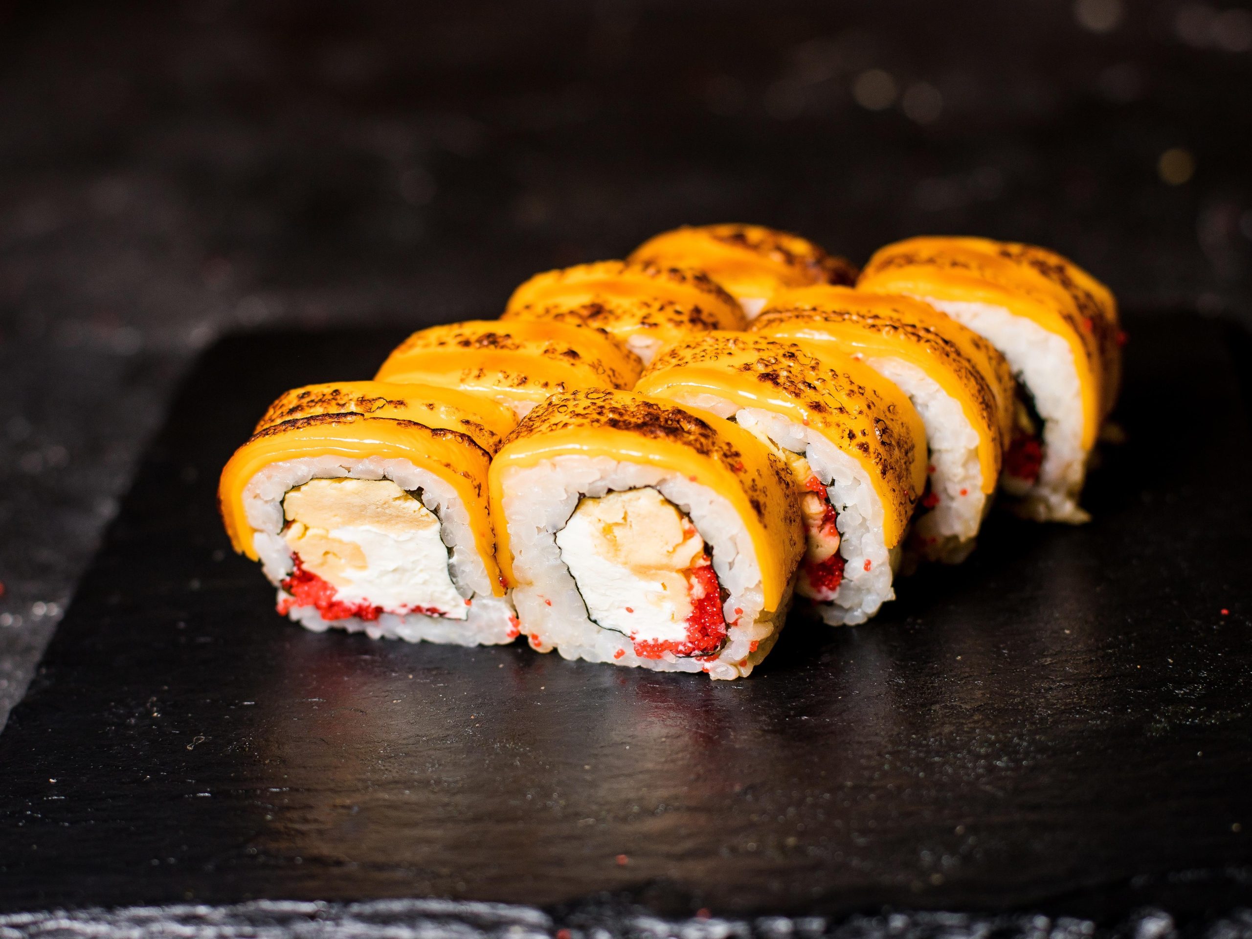 Torched sushi roll with cheese, fish roe and rice at Masa Sushi & Hibachi, a Japanese Restaurant in Marlboro Township