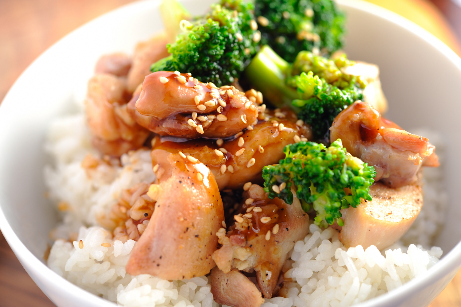 Teriyaki chicken rice bowl with tender chicken chunks, sesame seeds and broccoli at Maya, an Asian Fusion Restaurant in Pittsburgh