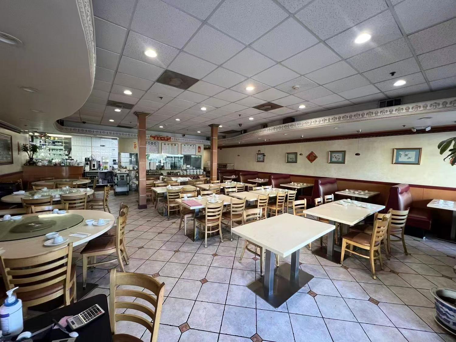 Spacious dining area with tables and booths at May Mei, a Cantonese Restaurant in Arcadia