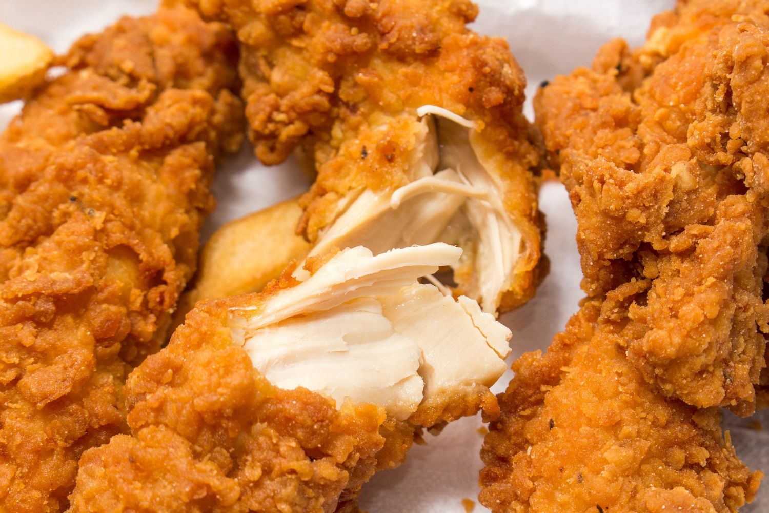 Crispy fried chicken tenders with tender white meat inside at MBL & Q Burger, Fried Chicken Shop in Rowland Heights