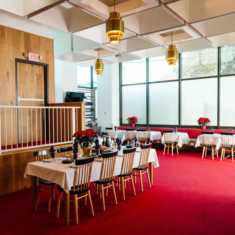Elegant dining room with red carpet and golden lights at Megu French Japanese Cuisine in Fort Worth