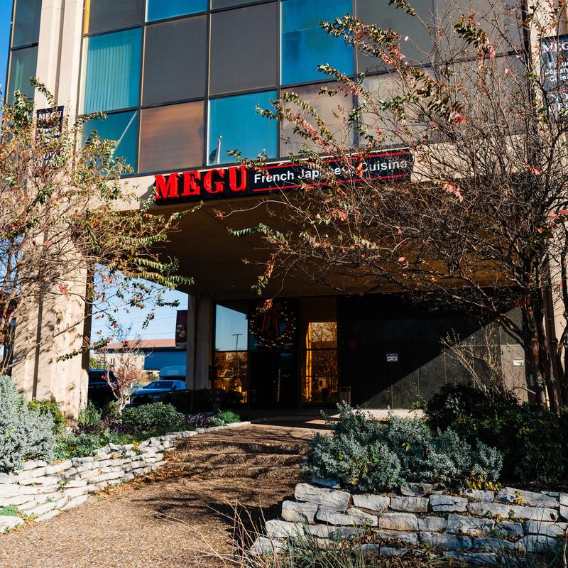 Exterior of Megu French Japanese Cuisine with "MEGU" sign at Megu French Japanese Cuisine in Fort Worth