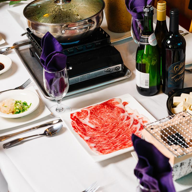 Shabu - shabu set with hot pot, beef and wines at Megu French Japanese Cuisine in Fort Worth