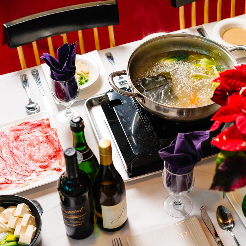 Shabu - shabu meal with hot pot, meat and wines at Megu French Japanese Cuisine in Fort Worth