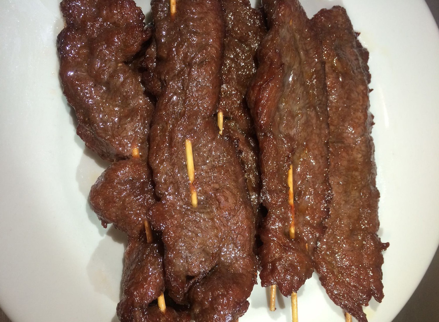 Tender beef skewers with savory glaze, a delicious appetizer at Mei-King Restaurant, a Chinese Restaurant in Pawtucket