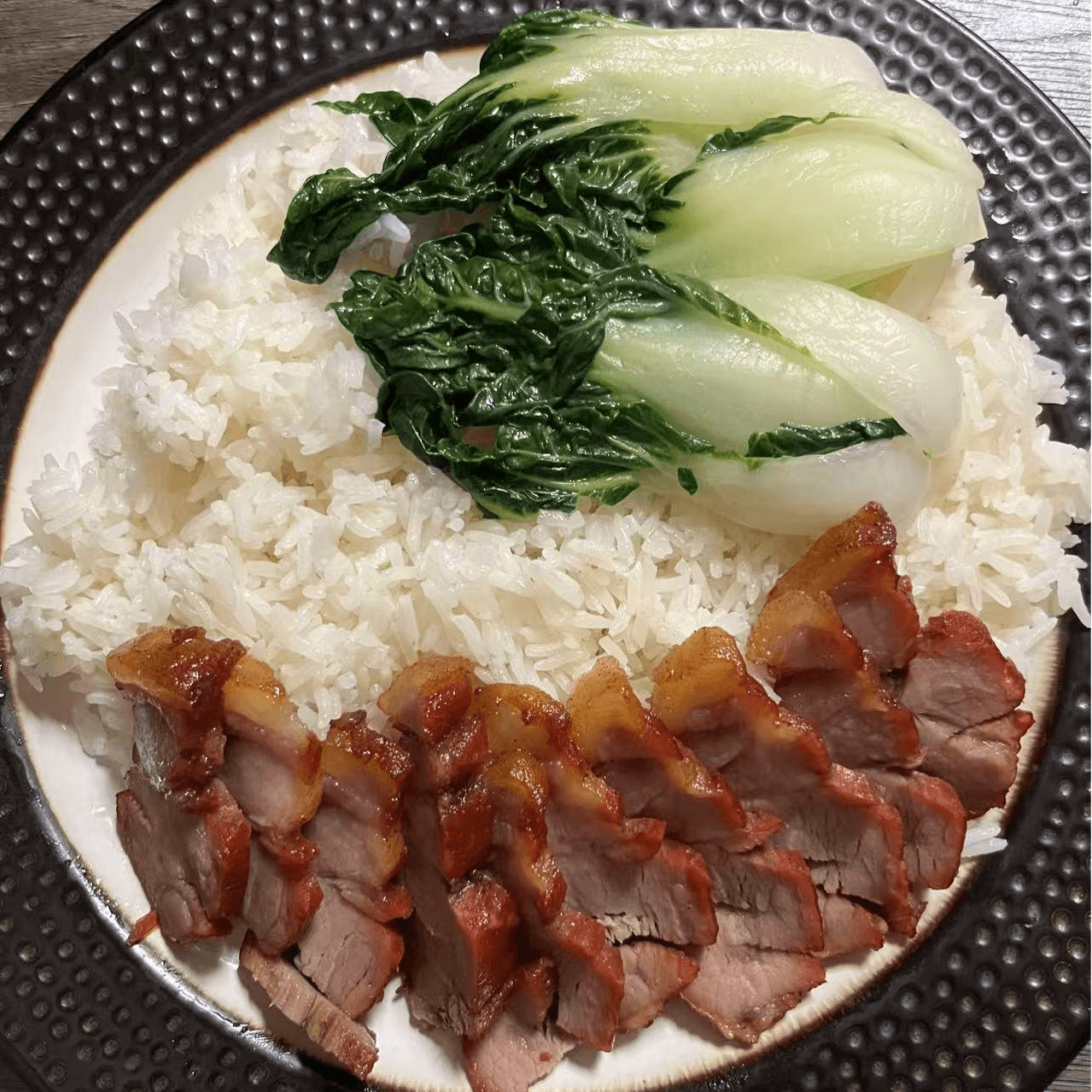 Tender BBQ honey pork served with rice and bok choy at Metro Hong Kong Dessert and Milk Tea, a Chinese Hong Kong Restaurant in San Francisco