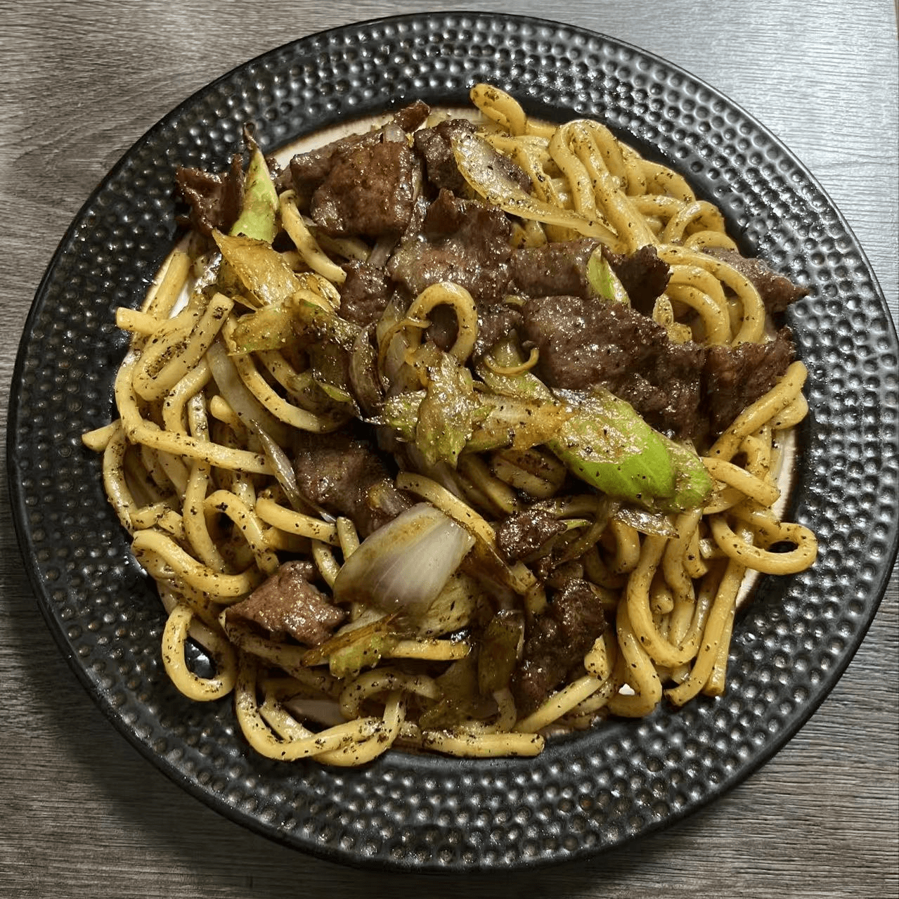 Udon noodles stir - fried with black pepper beef and veggies at Metro Hong Kong Dessert and Milk Tea, a Chinese Hong Kong Restaurant in San Francisco