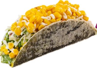 Black seaweed sushi taco filled with corn, shredded cabbage and creamy salad dressing at Mex Sushi Taco, a Asian restaurant in Place maspeth