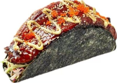 Glazed eel sushi taco topped with tobiko, sesame and creamy sauce over fresh coleslaw at Mex Sushi Taco, a Asian restaurant in Place maspeth