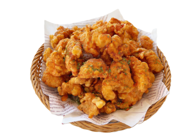 Herb-spiced crispy fried popcorn chicken piled inside woven wicker serving basket at Mex Sushi Taco, a Asian restaurant in Place maspeth