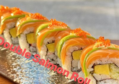 Double Salmon sushi roll with fresh salmon, avocado, tamago and tobiko garnish at Mex Sushi Taco, a Asian restaurant in Place maspeth