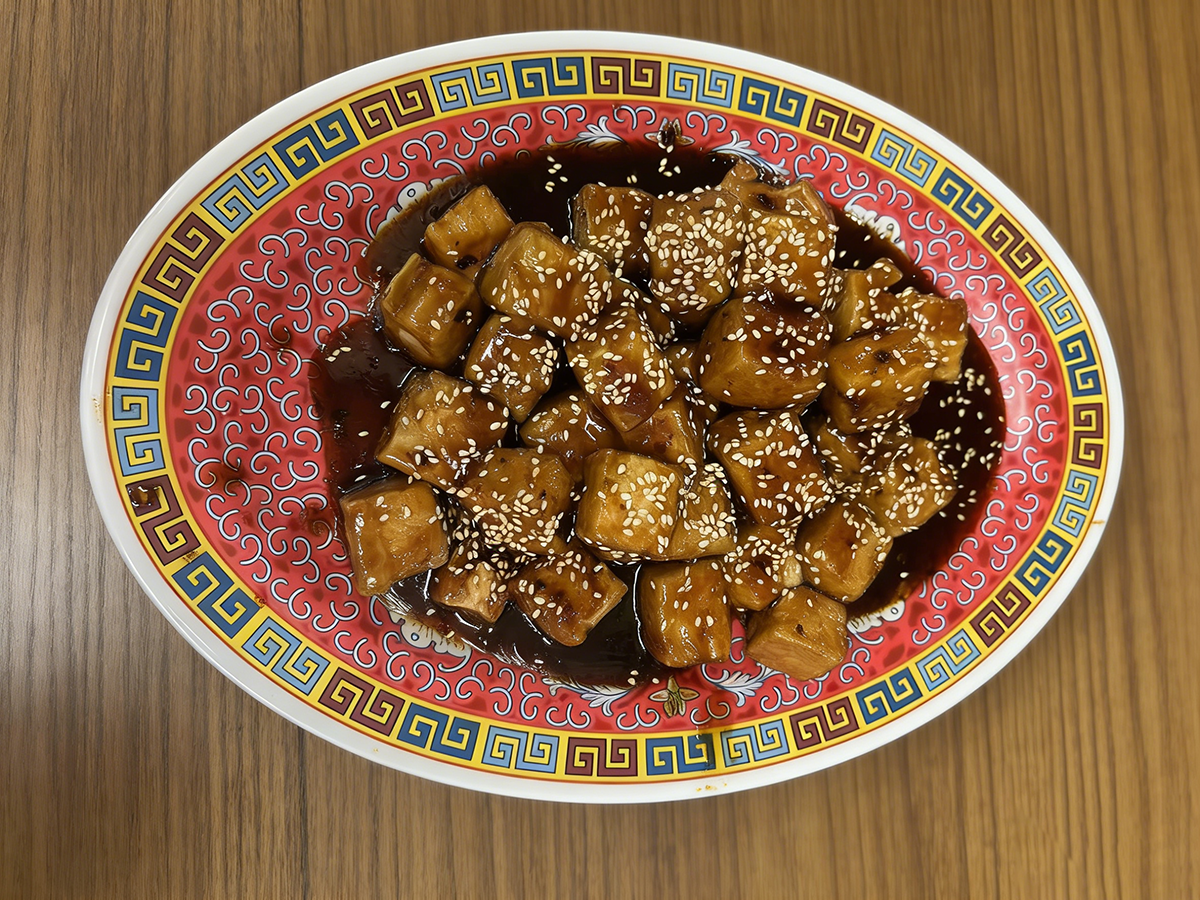 Sesame-topped glazed tofu cubes in dark sauce at Ming's Garden, a Chinese Restaurant in Bucksport