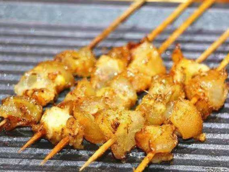 Grilled beef tendon skewers with seasoning at Pearl BBQ: Chinese Food Truck, a Chinese Restaurant in Elmhurst