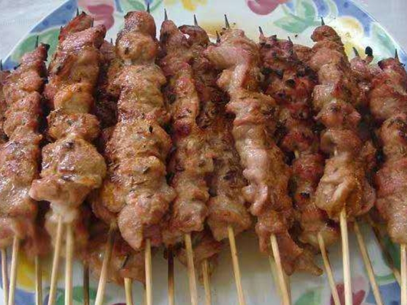 Grilled chicken skewers with savory seasoning at Pearl BBQ: Chinese Food Truck, a Chinese Restaurant in Elmhurst