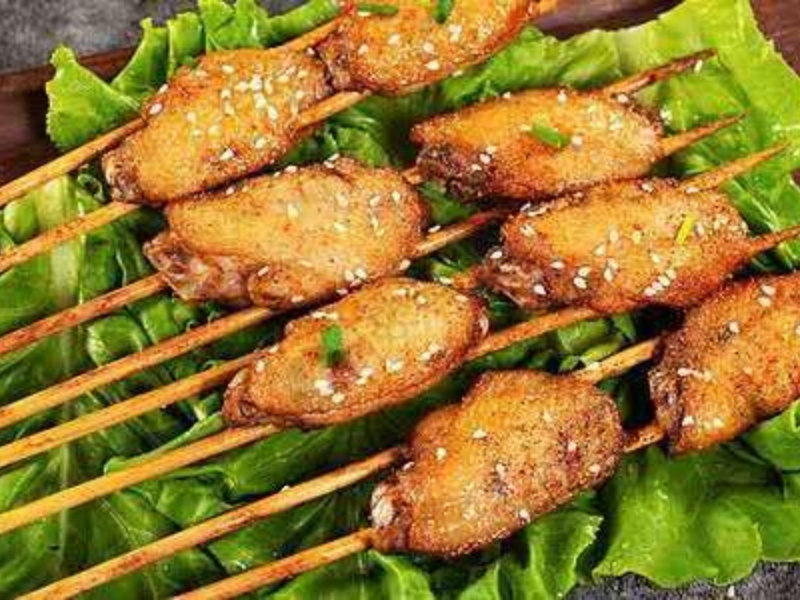 Grilled chicken wing mid skewers with sesame at Pearl BBQ: Chinese Food Truck, a Chinese Restaurant in Elmhurst