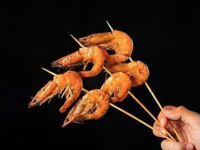 Grilled shrimp skewers with charred edges at Pearl BBQ: Chinese Food Truck, a Chinese Restaurant in Elmhurst