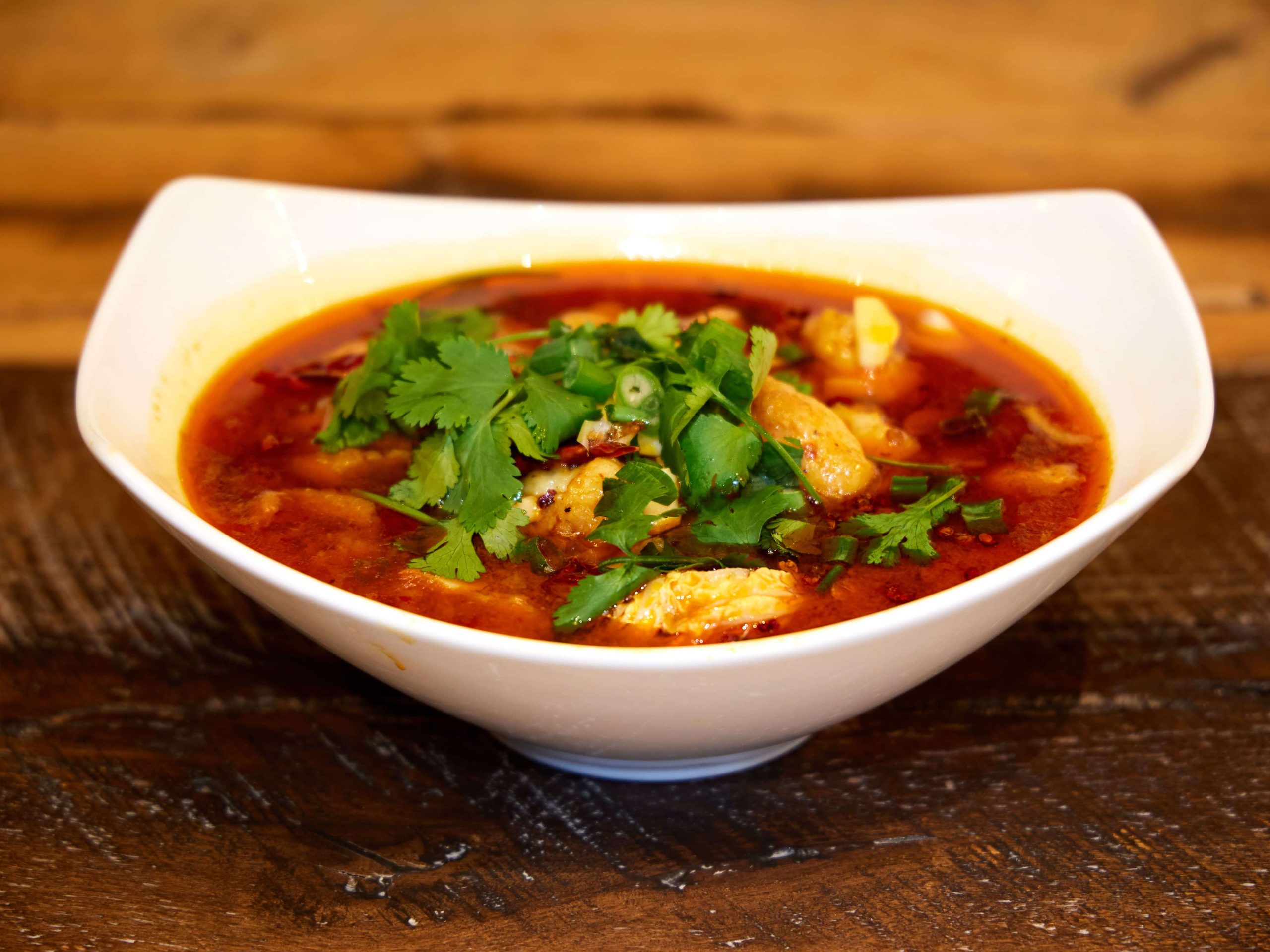 Tender fish in spicy Sichuan broth with cilantro at Mini Bowl Express, a Chinese Restaurant in Loma Linda