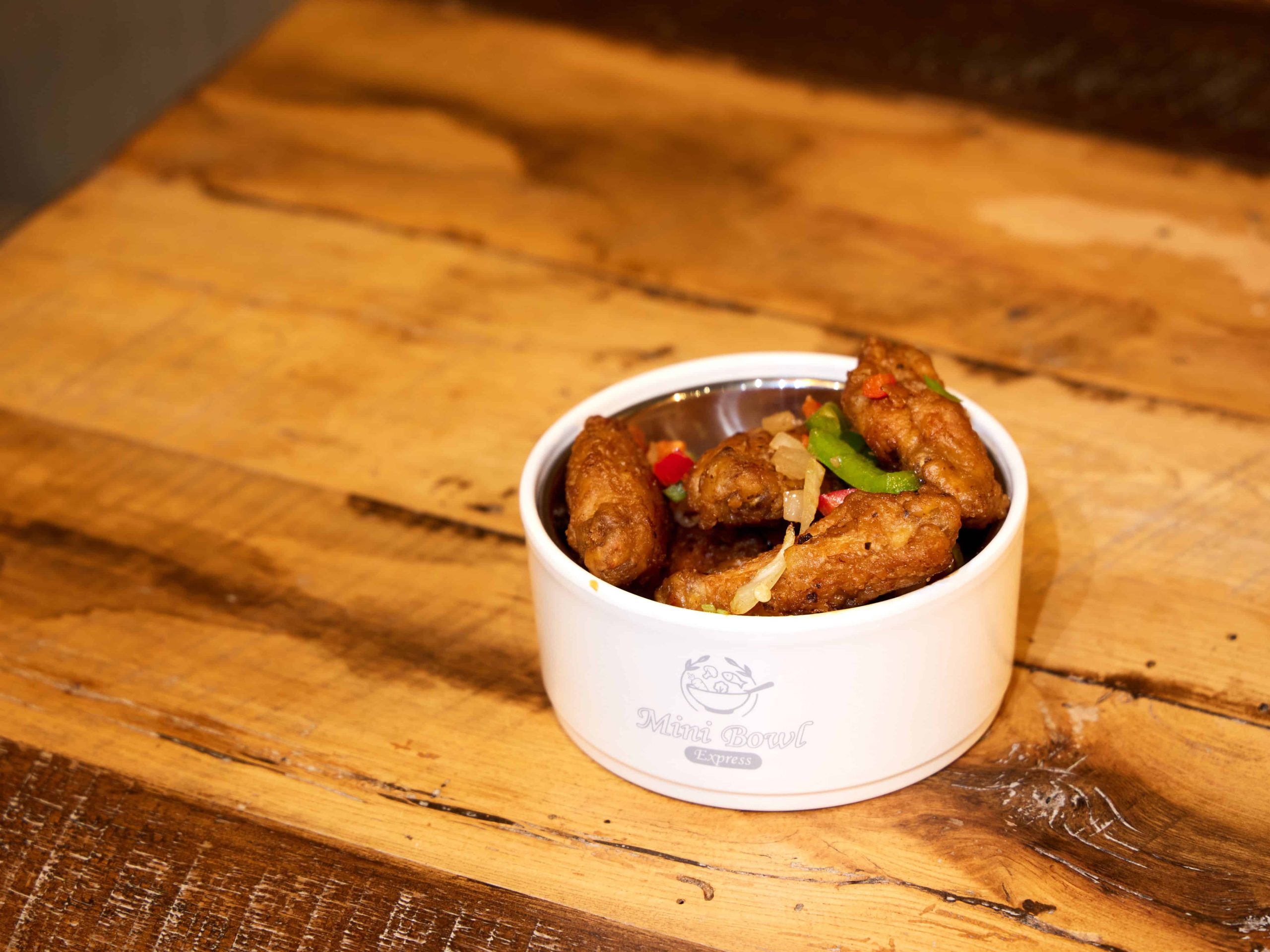 Crispy chicken wings with salt and pepper seasoning at Mini Bowl Express, a Chinese Restaurant in Loma Linda