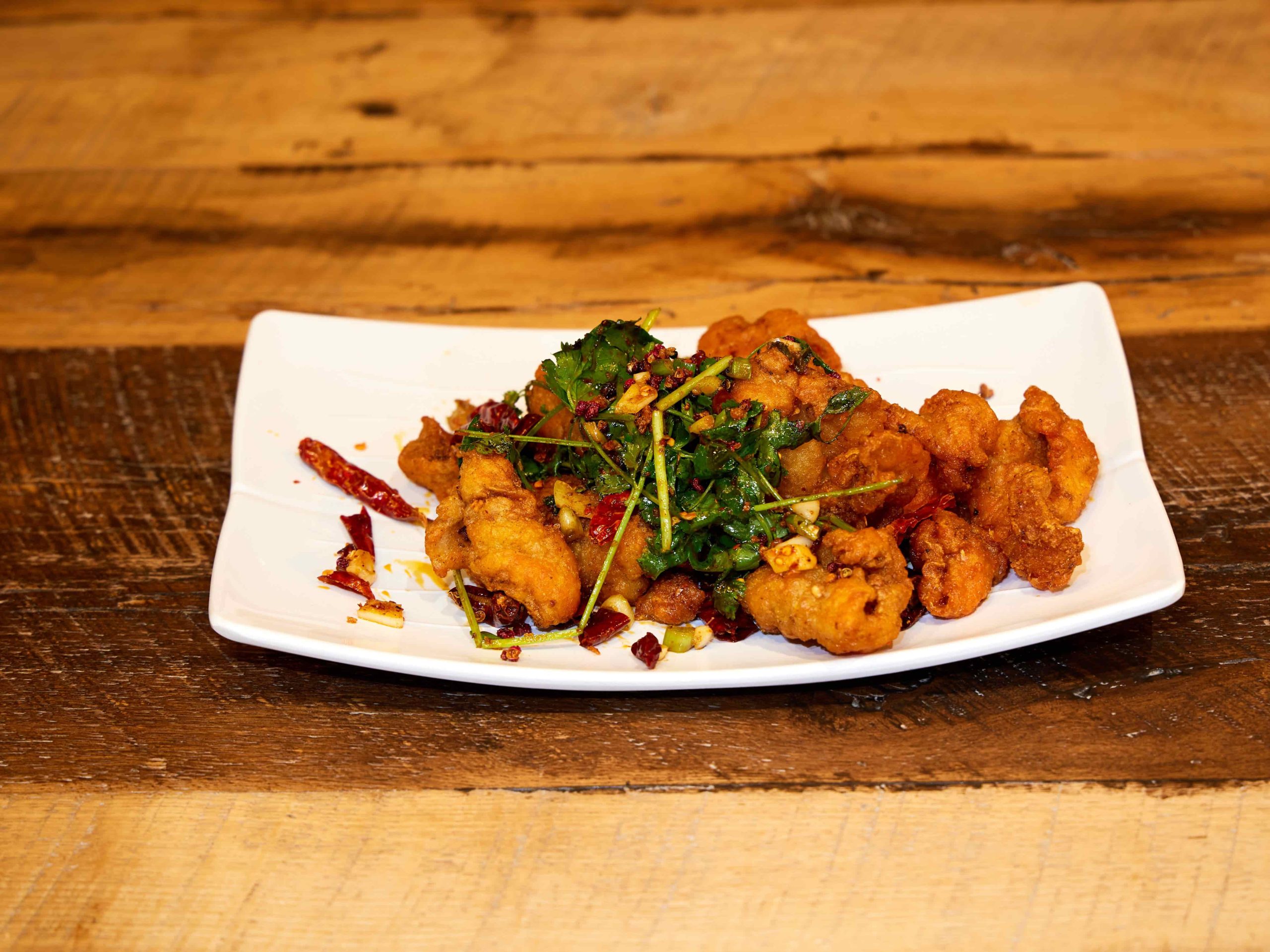 Crispy fried chicken with Sichuan chili and cilantro at Mini Bowl Express, a Chinese Restaurant in Loma Linda