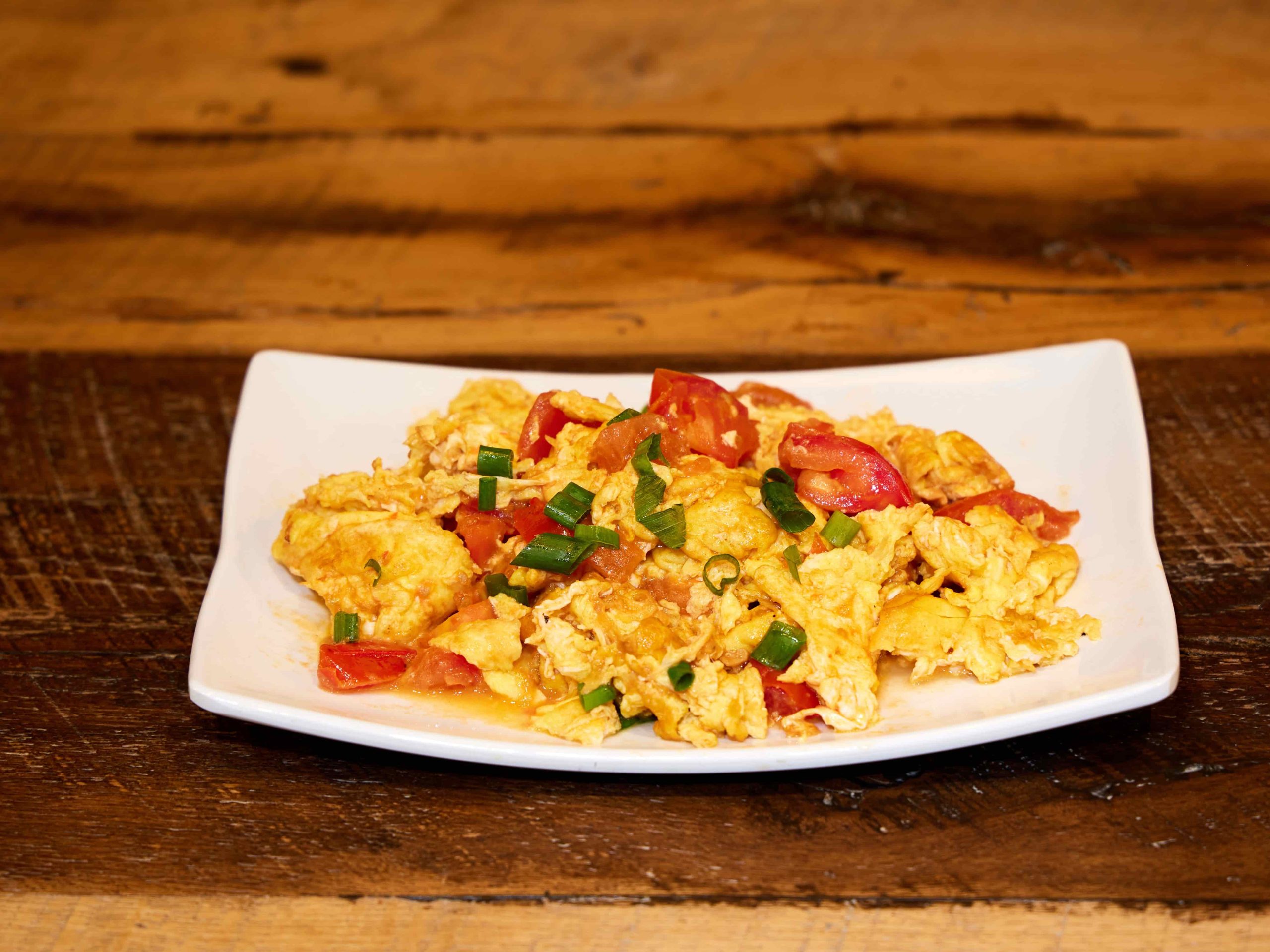Fluffy eggs stir-fried with fresh tomatoes and scallions at Mini Bowl Express, a Chinese Restaurant in Loma Linda