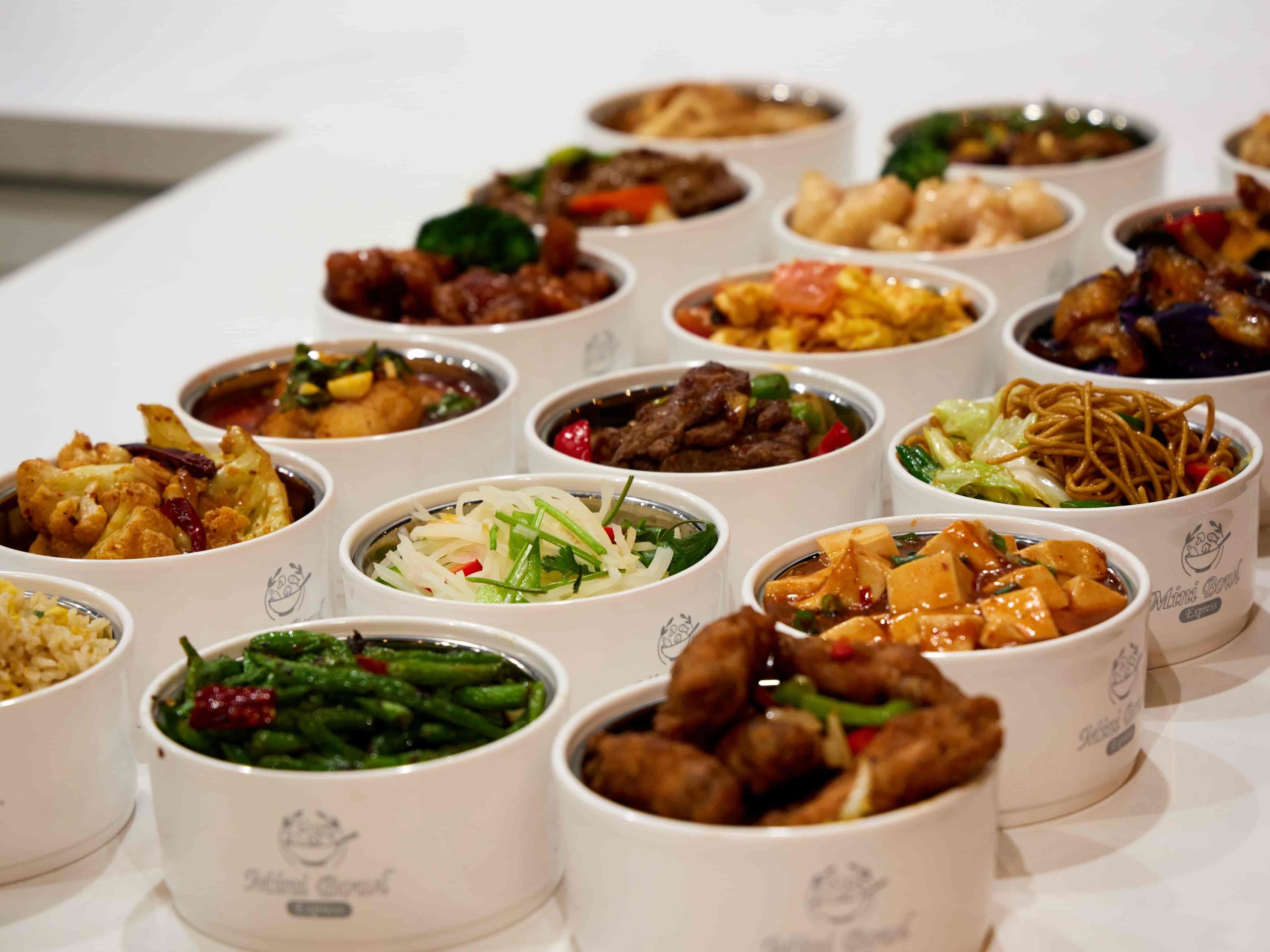 Mini-Bowl-Express-Chinese-Restaurant-Premium-Mini-Bowl-Feast-Loma-Linda Assorted mini bowl feast with signature Chinese dishes at Mini Bowl Express, a Chinese Restaurant in Loma Linda