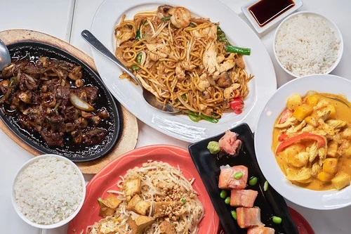 Assorted dishes including fried noodles, rice, and stir - fries at Mint Bistro，a Asian Fusion Restaurant in Milford