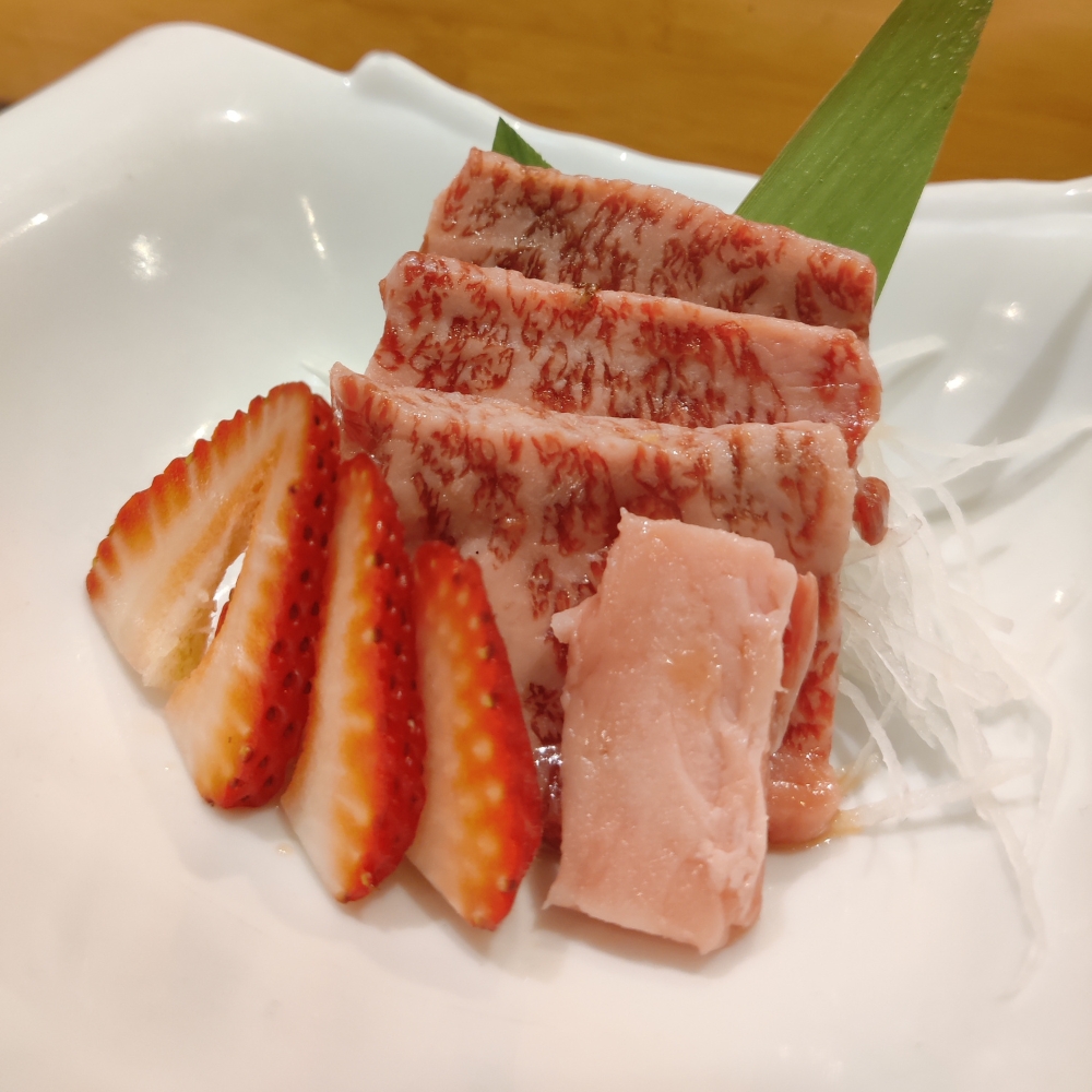 Seared wagyu sashimi served with sliced strawberry at Miso, a Japanese Restaurant in New Haven