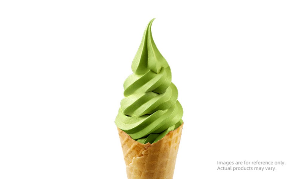Matcha flavored soft serve ice cream in a waffle cone at MIXUE, an Ice cream shop in Hollywood