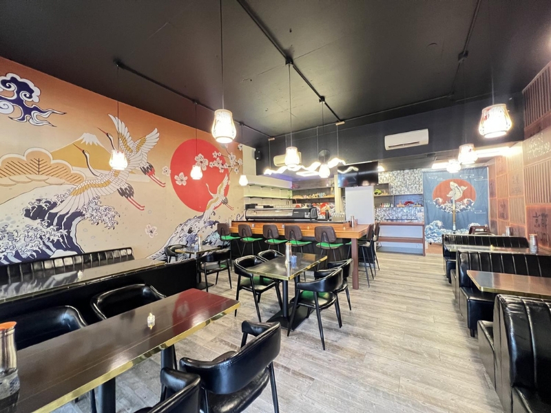 Inviting front dining zone with booths and tables at Miyazaki Sushi & IZAKAYA, a Japanese Restaurant in Kailua-Kona.