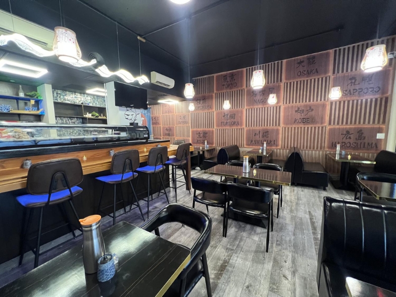 Sleek sushi bar with high stools at Miyazaki Sushi & IZAKAYA, a Japanese Restaurant in Kailua-Kona.