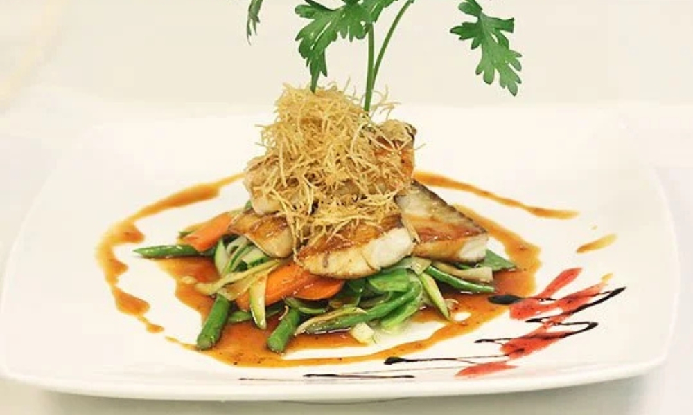 Seared red tilapia with veggies and sauce at Mizu Japanese Restaurant, a Japanese Restaurant in Winston-Salem