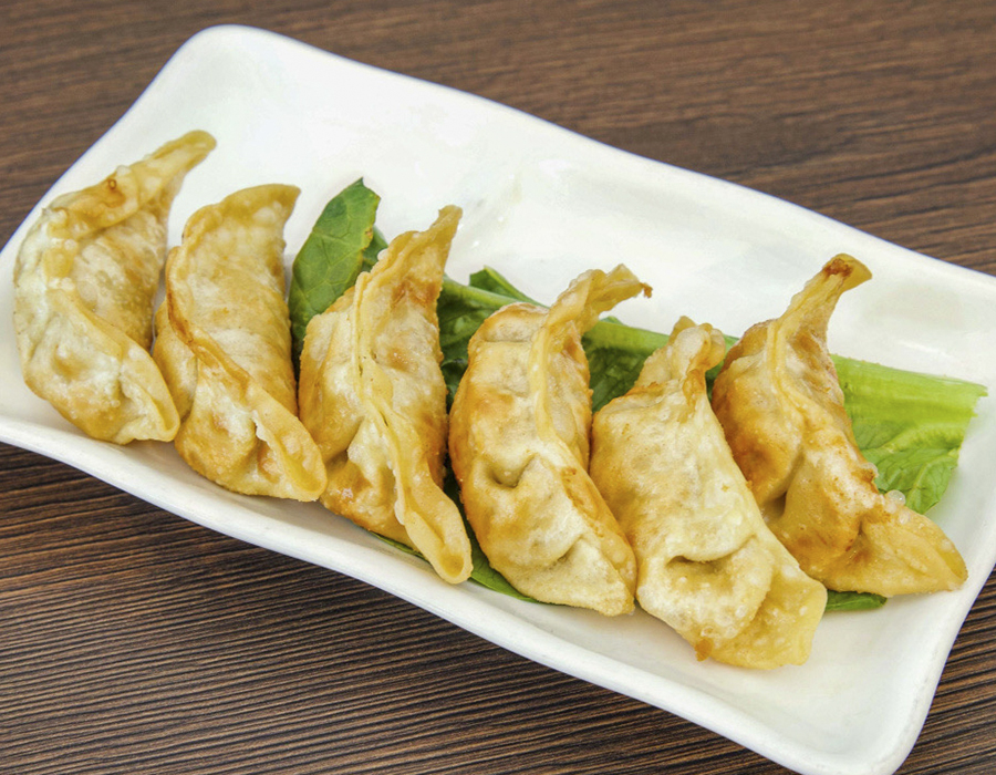 Crispy fried gyoza dumplings on fresh lettuce at Moana Hawaiian BBQ Restaurant in Fairfield