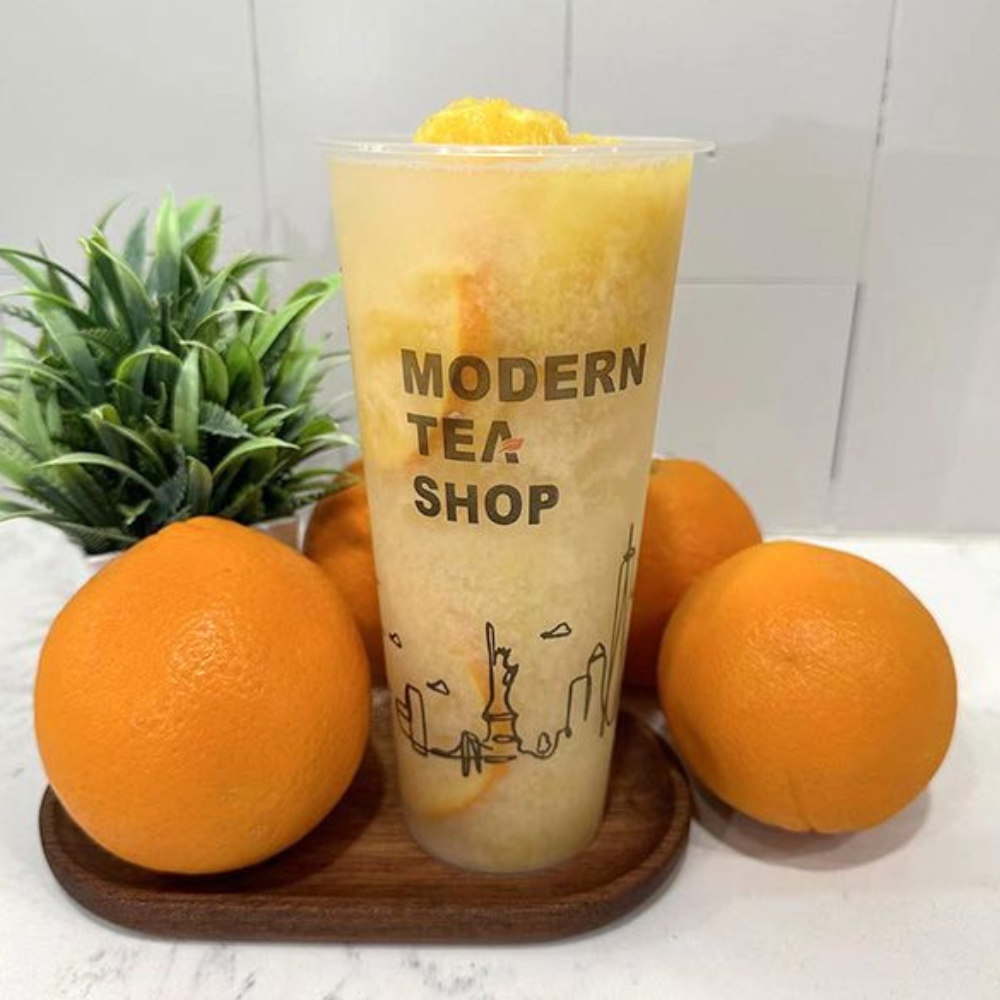 Fresh orange pulp fruit tea with ice at Modern Tea・Salad, Salad shop in New York