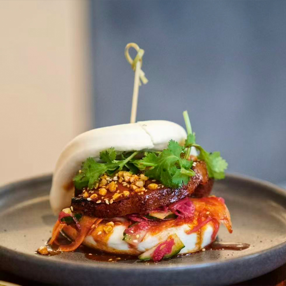 Pork Belly Gua Bao Steamed Pork Bun at Momotaro Ramen & Sushi, Japanese Restaurant in Pensacola