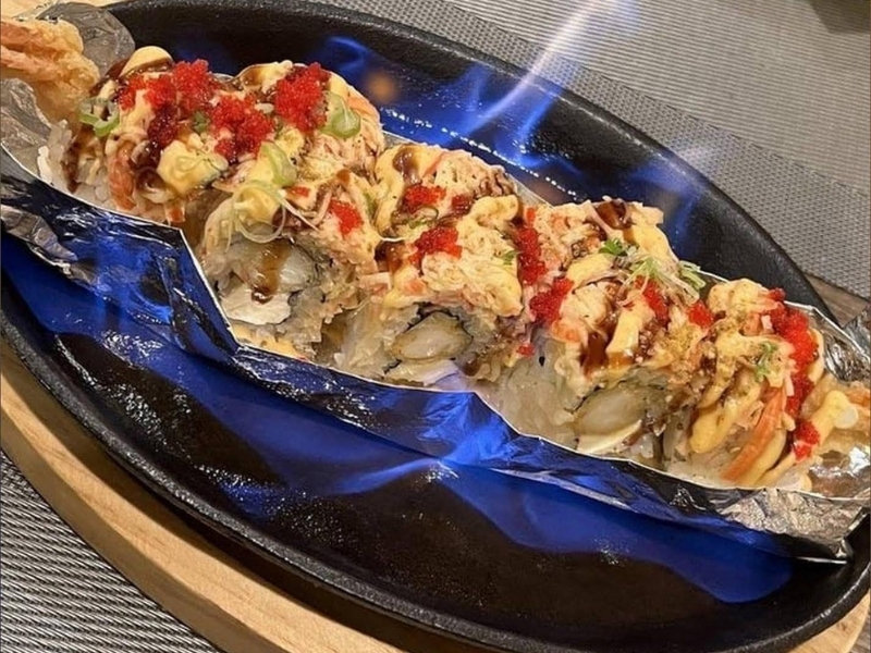 Flame-seared sushi roll with toppings at Mori Sushi, a Japanese Restaurant in Indianapolis