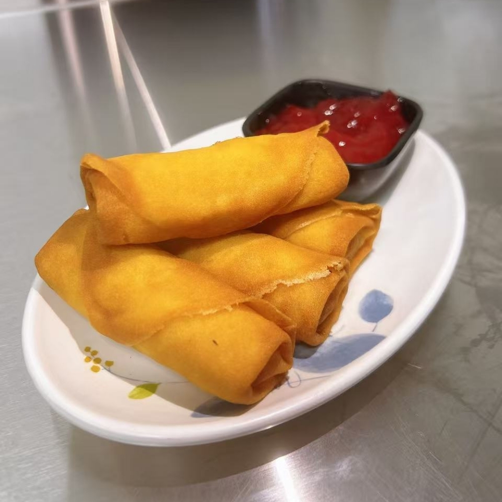 Crispy fried spring rolls with ketchup at Mr.Noodle, an Chinese Restaurant in Corona
