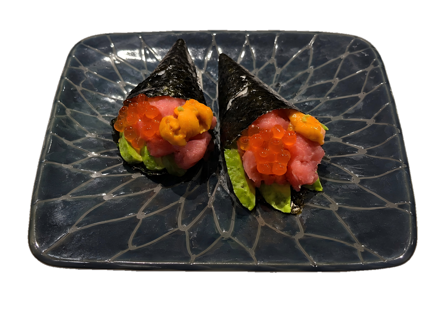 Tuna Hand Rolls topped with uni and salmon roe, served on a decorative ceramic plate at a Japanese sushi restaurant