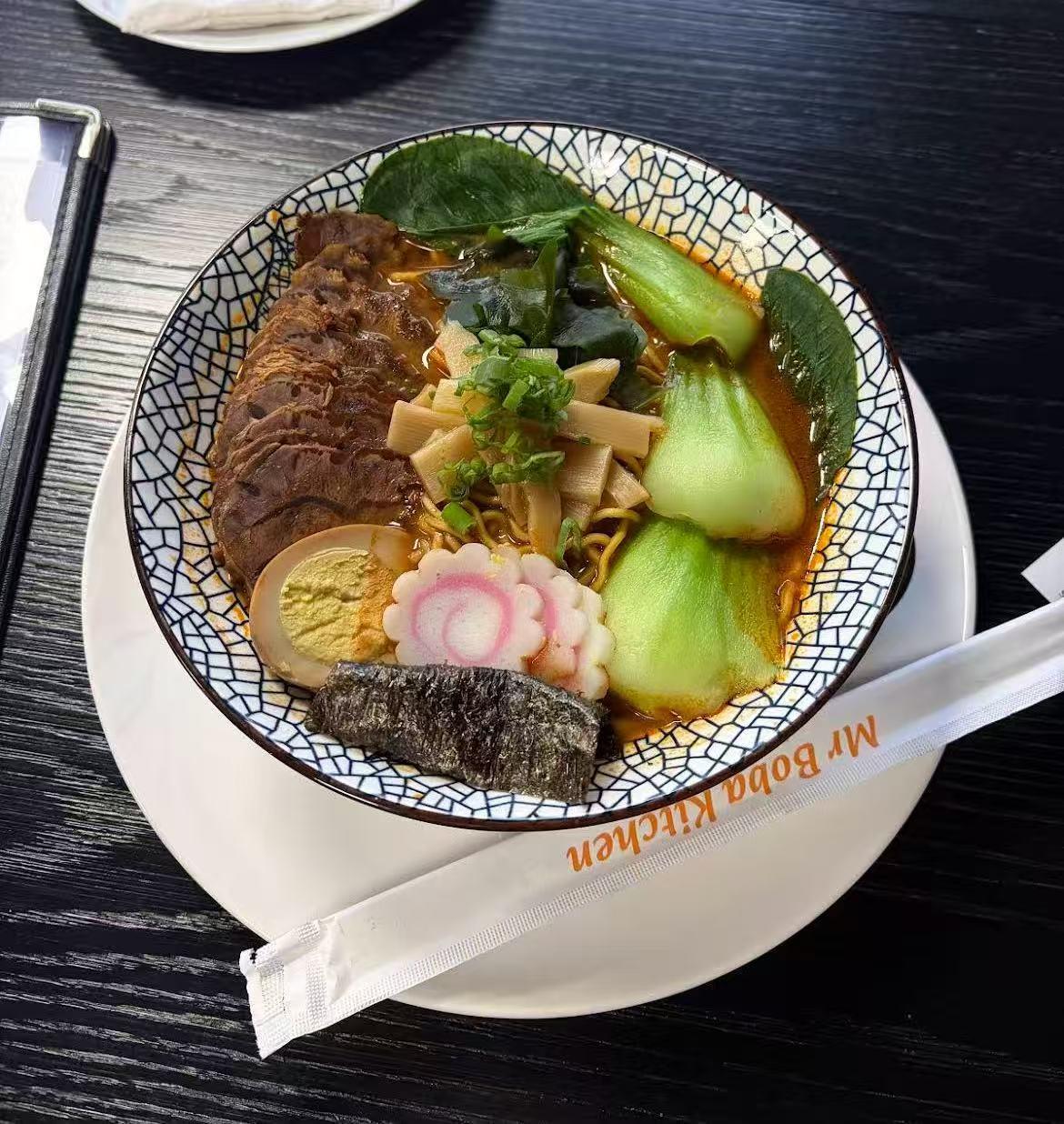 Avocado-wrapped sushi rolls with sauce & garnish at Mr Boba Kitchen , a Asian Fusion Restaurant in New Windsor