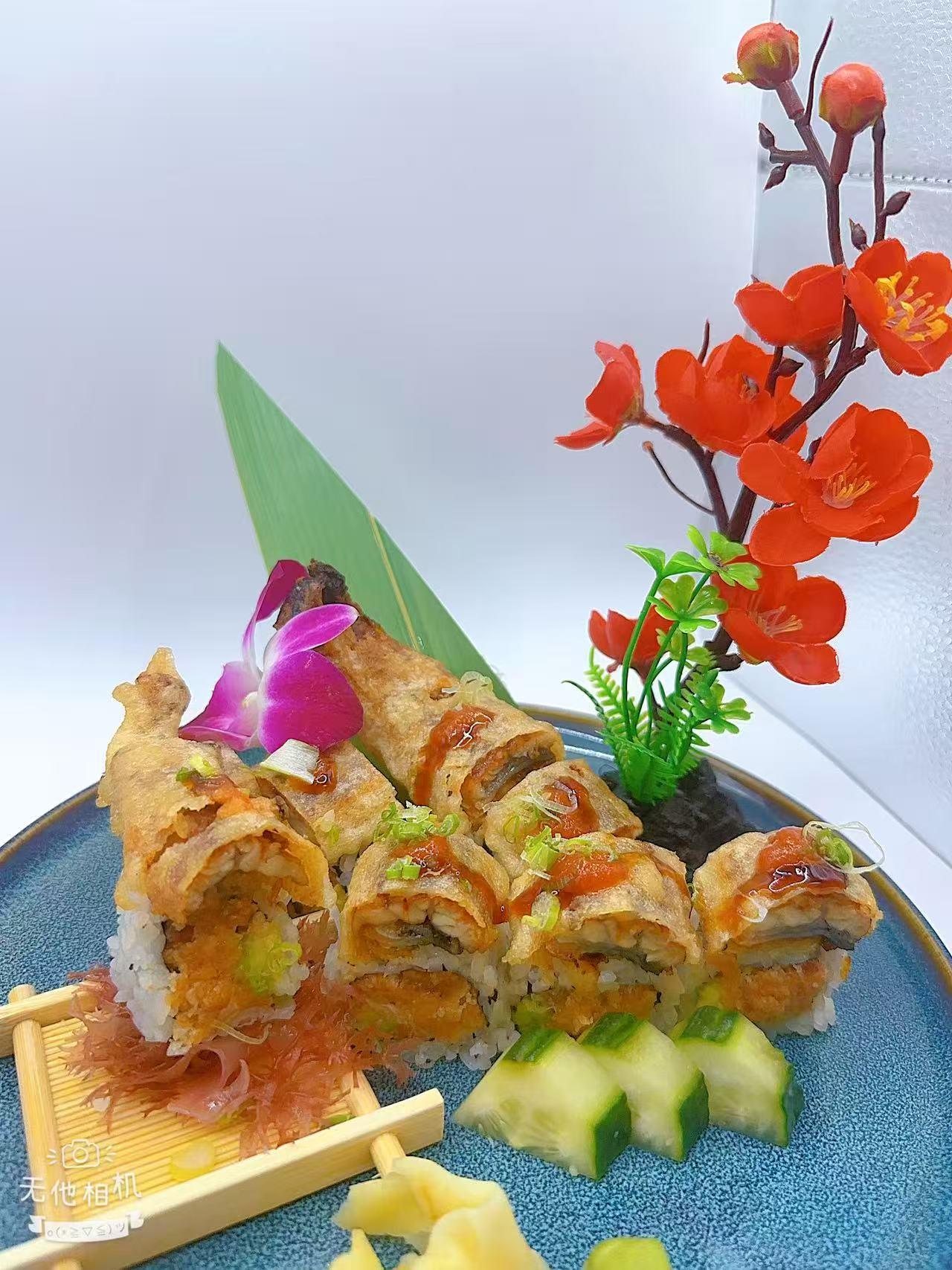 Eel-topped sushi roll with savory fillings at Mr Boba Kitchen , a Asian Fusion Restaurant in New Windsor