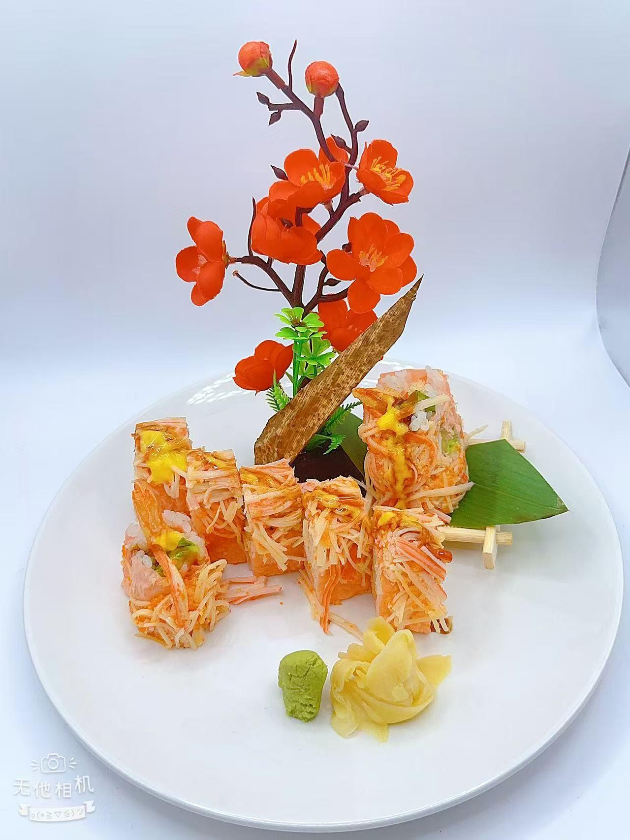 Shredded crab-topped sushi roll with sauce at Mr Boba Kitchen , a Asian Fusion Restaurant in New Windsor