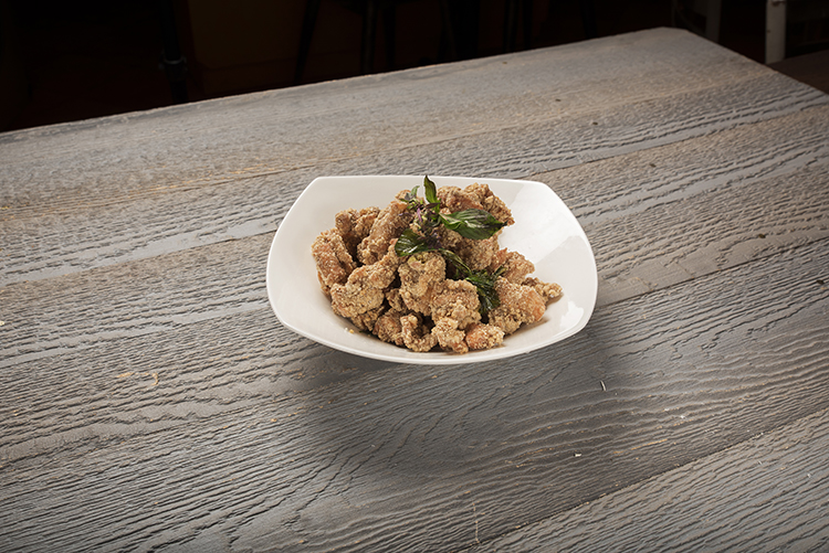 Taiwanese popcorn chicken with basil leaves at Mr.Dragon Noodle House, a Chinese Restaurant in CA