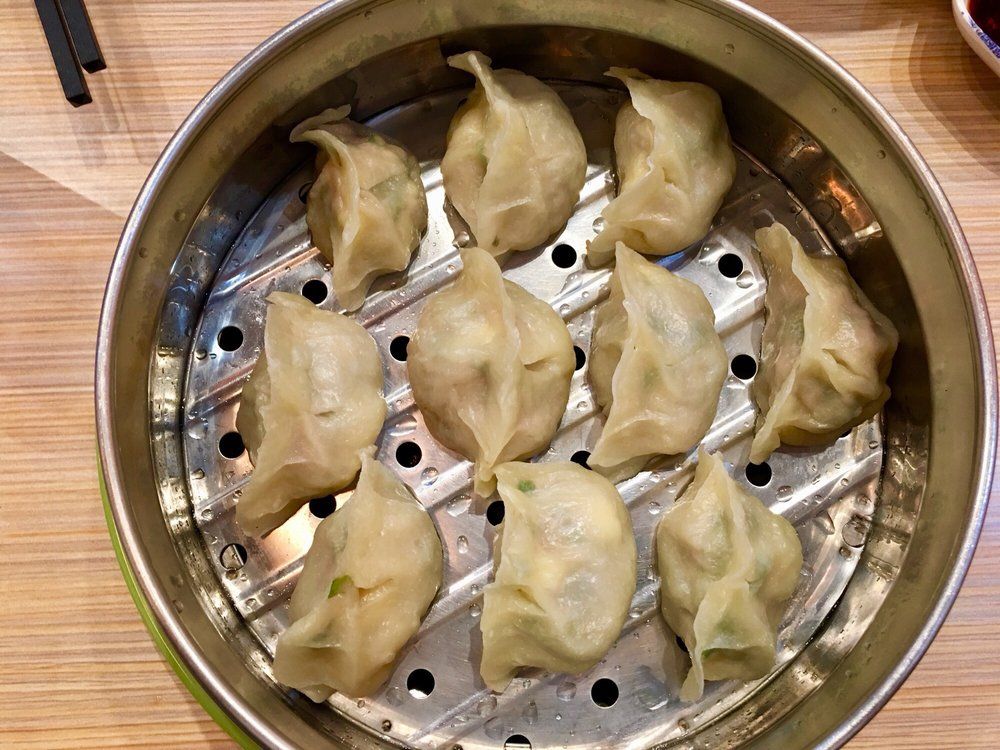 Steamed juicy dumplings served in metal steamer basket at Mr Dumpling, a Chinese Noodle Restaurant in Rancho Cucamonga