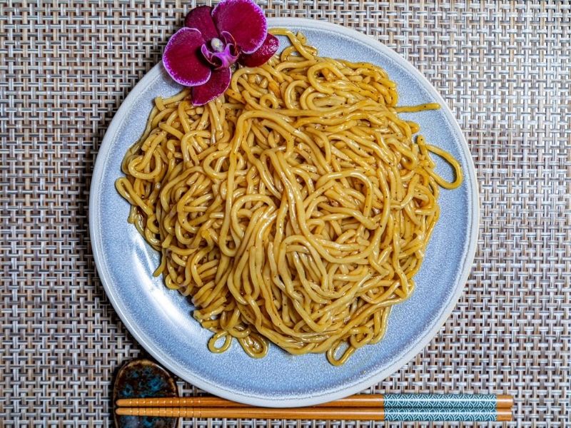 Plain stir-fried thick lo mein noodles garnished with orchid at Mr.Hibachi Japanese Grill, a Japanese Restaurant in Dover