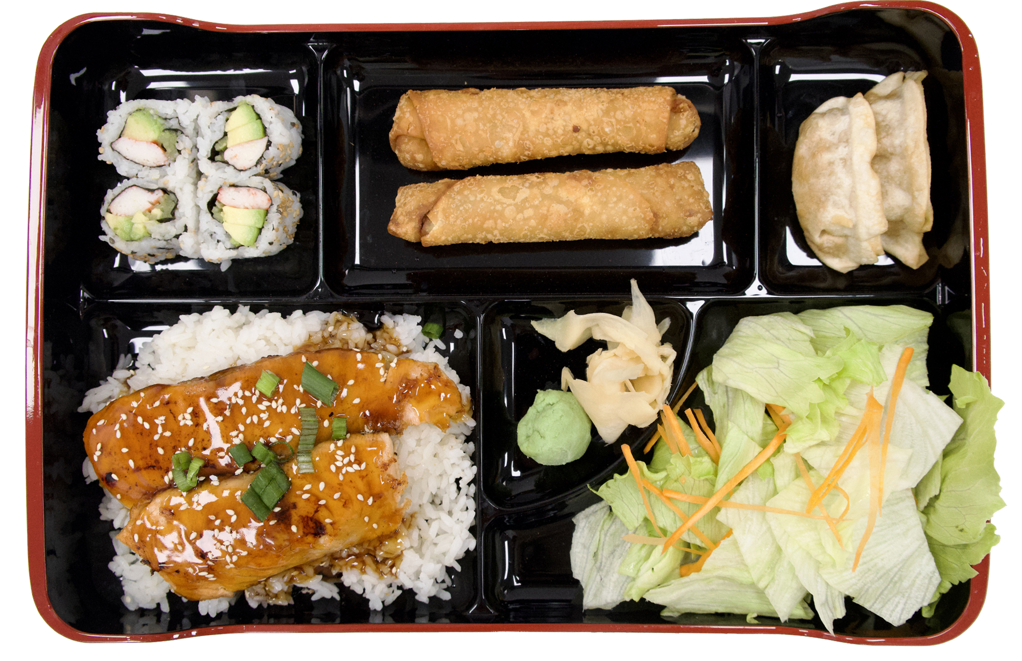Divided bento tray with teriyaki salmon rice, sushi rolls, egg rolls, dumplings and crisp lettuce salad at Mr. Teriyaki, a Asian Restaurant in San Antonio