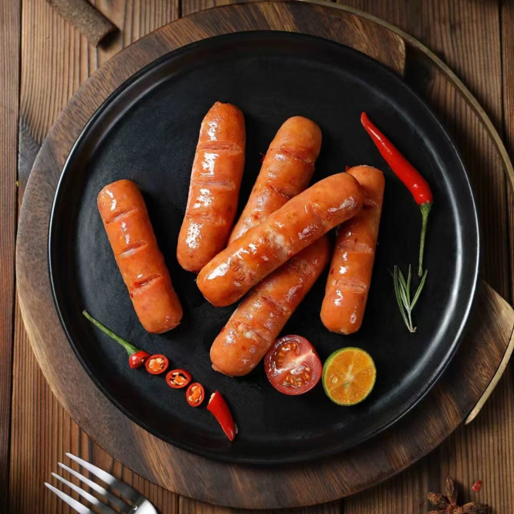 Grilled sausages garnished with chili, tomato, and lemon slices at Mr Zhang Kitchen, a Asian restaurant in River Edge
