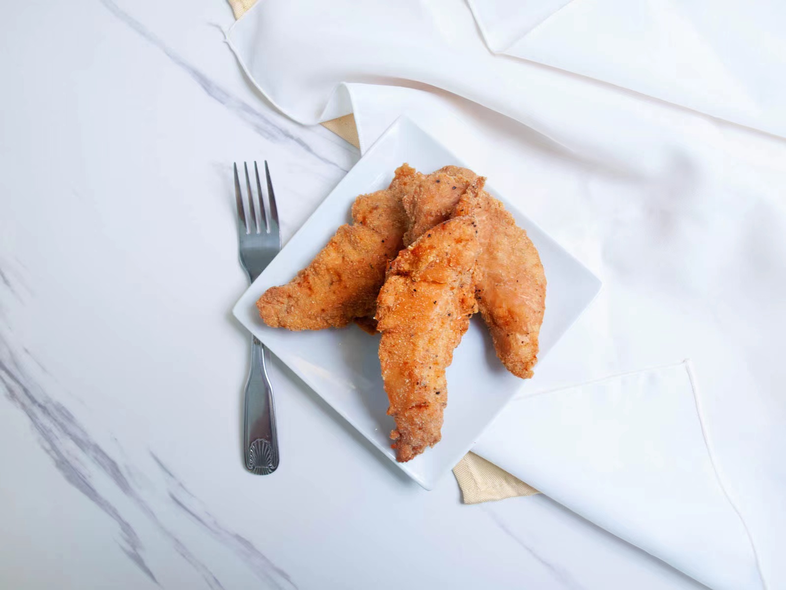 Golden breaded crispy chicken tenders at M TOWN WING, a Chicken Wings Restaurant in Middletown